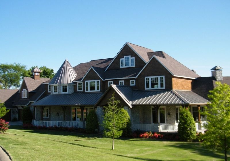 Shingled residential home with covered porch